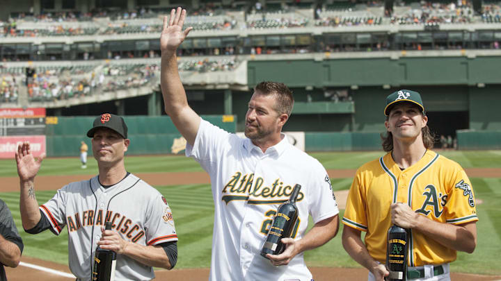 Sep 27, 2015; Oakland, CA, USA; San Francisco Giants starting pitcher Tim Hudson (17) and Oakland Athletics former starting pitcher Mark Mulder and Athletics starting pitcher Barry Zito (75) accept gifts from the Oakland Athletics before the game at O.co Coliseum. Mandatory Credit: Ed Szczepanski-Imagn Images Sep 27, 2015; Oakland, CA, USA; San Francisco Giants starting pitcher Tim Hudson (17) and Oakland Athletics former starting pitcher Mark Mulder and Athletics starting pitcher Barry Zito (75) accept gifts from the Oakland Athletics before the game at O.co Coliseum. Mandatory Credit: Ed Szczepanski-Imagn Images
