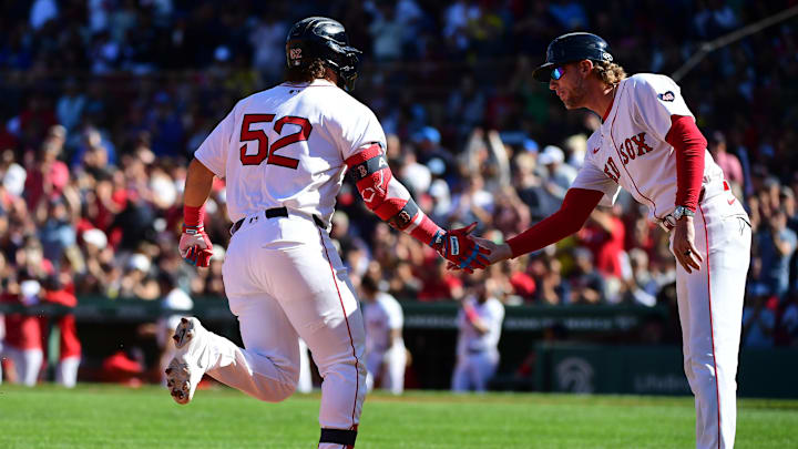 Sep 8, 2024; Boston, Massachusetts, USA;  Boston Red Sox right fielder Wilyer Abreu (52) is congratulated by Boston Red Sox third base coach Kyle Hudson (84) after hitting a home run during the sixth inning against the Chicago White Sox at Fenway Park. Mandatory Credit: Bob DeChiara-Imagn Images