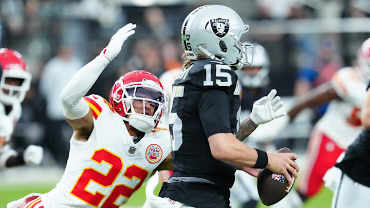 Oct 27, 2024; Paradise, Nevada, USA; Kansas City Chiefs cornerback Trent McDuffie (22) looks to sack Las Vegas Raiders quarterback Gardner Minshew (15) during the second quarter at Allegiant Stadium. Mandatory Credit: Stephen R. Sylvanie-Imagn Images Oct 27, 2024; Paradise, Nevada, USA; Kansas City Chiefs cornerback Trent McDuffie (22) looks to sack Las Vegas Raiders quarterback Gardner Minshew (15) during the second quarter at Allegiant Stadium. Mandatory Credit: Stephen R. Sylvanie-Imagn Images