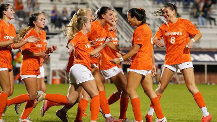 The Cavaliers celebrate Addison Halpern's game-winnger over Louisville. The Cavaliers celebrate Addison Halpern's game-winnger over Louisville.