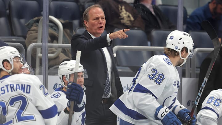 Dec 2, 2025; Elmont, New York, USA; Tampa Bay Lightning head coach Jon Cooper coaches against the New York Islanders during the first period at UBS Arena. Mandatory Credit: Brad Penner-Imagn Images Dec 2, 2025; Elmont, New York, USA; Tampa Bay Lightning head coach Jon Cooper coaches against the New York Islanders during the first period at UBS Arena. Mandatory Credit: Brad Penner-Imagn Images