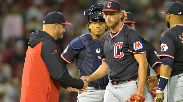 Apr 5, 2025; Anaheim, California, USA;  Cleveland Guardians manager Stephen Vogt (12) pulls starting pitcher Tanner Bibee (28) in the fifth inning against the Los Angeles Angels at Angel Stadium. Mandatory Credit: Jayne Kamin-Oncea-Imagn Images