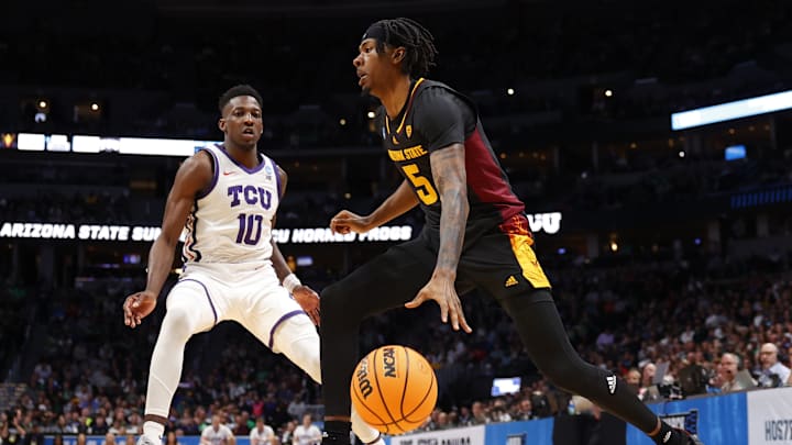 Mar 17, 2023; Denver, CO, USA; Arizona State Sun Devils forward Jamiya Neal (5) dribbles against TCU Horned Frogs guard Damion Baugh (10) during the second half at Ball Arena. Mandatory Credit: Michael Ciaglo-Imagn Images