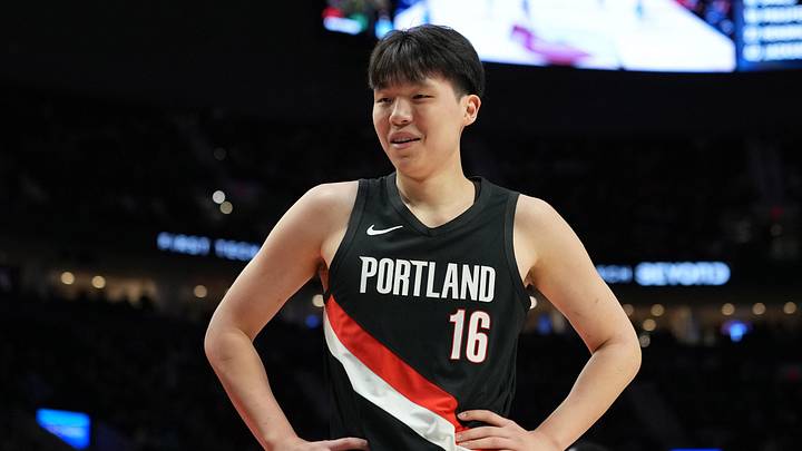 Feb 7, 2026; Portland, Oregon, USA; Portland Trail Blazers center Yang Hansen (16) reacts to a call during the first half against the Memphis Grizzlies at Moda Center. Mandatory Credit: Soobum Im-Imagn Images
