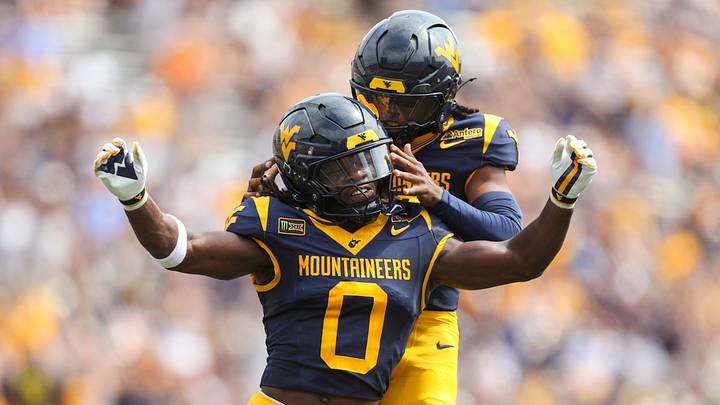 Sep 12, 2026; Morgantown, West Virginia, USA; West Virginia Mountaineers safety Andrew Powdrell (0) celebrates after a punt block with West Virginia Mountaineers defensive back Jaire Rawlison (22) during the first quarter against the UT Martin Skyhawks at Milan Puskar Stadium. Mandatory Credit: Ben Queen-Imagn Images Sep 12, 2026; Morgantown, West Virginia, USA; West Virginia Mountaineers safety Andrew Powdrell (0) celebrates after a punt block with West Virginia Mountaineers defensive back Jaire Rawlison (22) during the first quarter against the UT Martin Skyhawks at Milan Puskar Stadium. Mandatory Credit: Ben Queen-Imagn Images