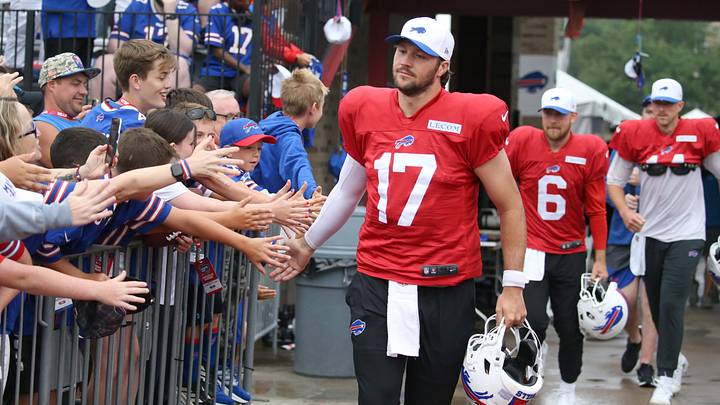 Bills quarterback Josh Allen leads the quarterbacks onto the field, high-fiving fans as they go, during day seven of Buffalo Bills training camp at St. John Fisher University Thursday, July 31, 2025 in Pittsford, NY. Bills quarterback Josh Allen leads the quarterbacks onto the field, high-fiving fans as they go, during day seven of Buffalo Bills training camp at St. John Fisher University Thursday, July 31, 2025 in Pittsford, NY.