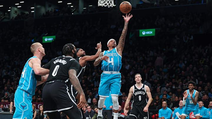 Mar 27, 2022; Brooklyn, New York, USA; Charlotte Hornets guard Isaiah Thomas (4) drives to the