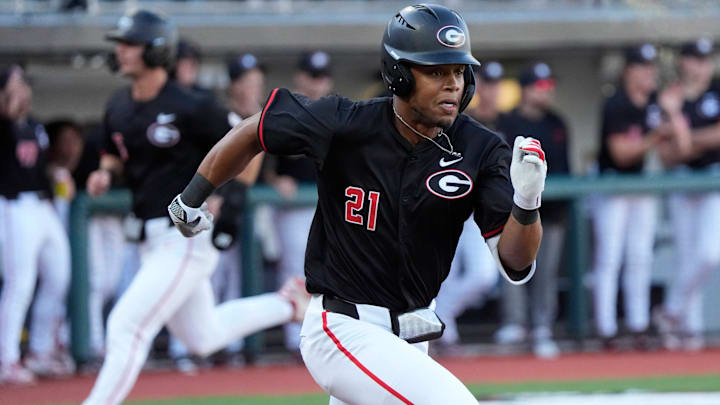 Georgia outfielder Devin Obee (21) runs for first during a NCAA baseball game against Arkansas in Athens, Ga., on Friday, April 11, 2025. Georgia outfielder Devin Obee (21) runs for first during a NCAA baseball game against Arkansas in Athens, Ga., on Friday, April 11, 2025.