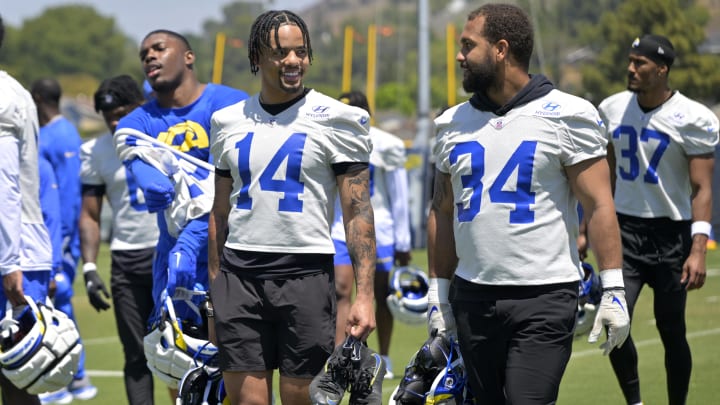 May 28, 2024; Thousand Oaks, CA, USA; Los Angeles Rams cornerback Cobie Durant (14) and safety Tanner Ingle (34) leave the field following OTAs at the team training facility at California Lutheran University. Mandatory Credit: Jayne Kamin-Oncea-USA TODAY Sports