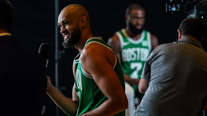 Oct 2, 2023; Boston, Celtics, USA; Boston Celtics guard Derrick White (9) and Boston Celtics guard Jaylen Brown (7) talk with sports media during Boston Celtics Media Day. Mandatory Credit: David Butler II-Imagn Images