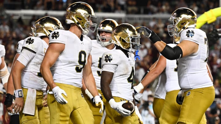 Aug 31, 2024; College Station, Texas, USA; Notre Dame Fighting Irish defensive lineman Joshua Burnham (4) celebrates with teammates after scoring a touchdown in the fourth quarter against the Texas A&M Aggies at Kyle Field. Mandatory Credit: Maria Lysaker-USA TODAY Sports