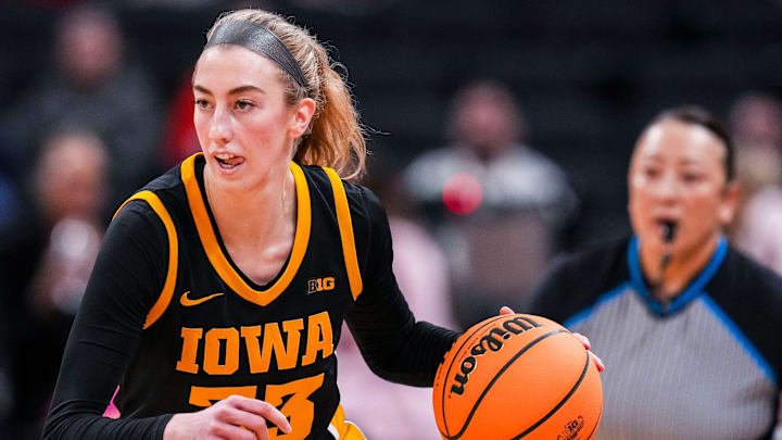 Iowa Hawkeyes guard Lucy Olsen (33) brings the ball up the court Friday, March 7, 2025, in a quarterfinals game at the 2025 TIAA Big Ten Women's Basketball Tournament between the Iowa Hawkeyes and the Ohio State Buckeyes at Gainbridge Fieldhouse in Indianapolis.
