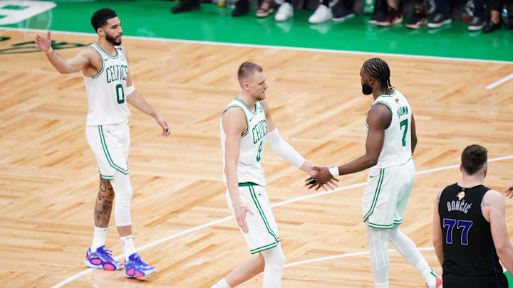 Jun 6, 2024; Boston, Massachusetts, USA; Boston Celtics center Kristaps Porzingis (8) and guard Jaylen Brown (7) and forward Jayson Tatum (0) 
