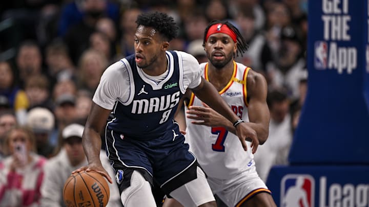 Feb 12, 2025; Dallas, Texas, USA; Dallas Mavericks forward Olivier-Maxence Prosper (8) and Golden State Warriors guard Buddy Hield (7) in action during the game between the Dallas Mavericks and the Golden State Warriors at the American Airlines Center. Mandatory Credit: Jerome Miron-Imagn Images