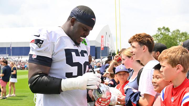 Jul 28, 2026; Foxborough, MA, USA; New England Patriots offensive tackle Marcus Bryant (52) signs an autograph for a fan after practice at training camp at Gillette Stadium. Mandatory Credit: Eric Canha-Imagn Images Jul 28, 2026; Foxborough, MA, USA; New England Patriots offensive tackle Marcus Bryant (52) signs an autograph for a fan after practice at training camp at Gillette Stadium. Mandatory Credit: Eric Canha-Imagn Images