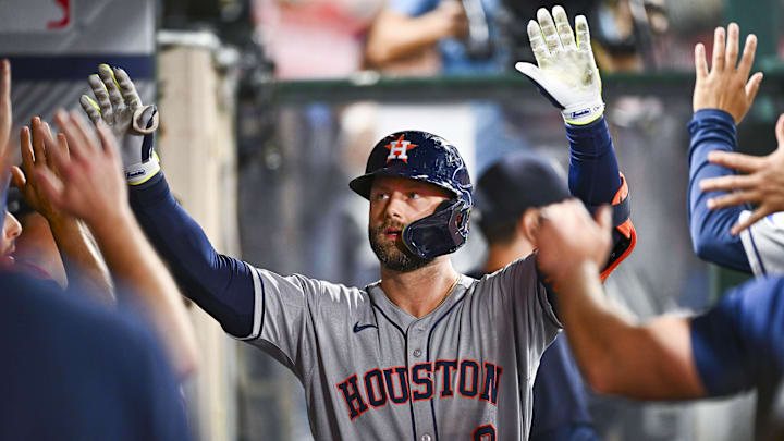 Houston Astros first baseman Christian Walker (8) celebrates with teammates after hitting a solo home run. Houston Astros first baseman Christian Walker (8) celebrates with teammates after hitting a solo home run.