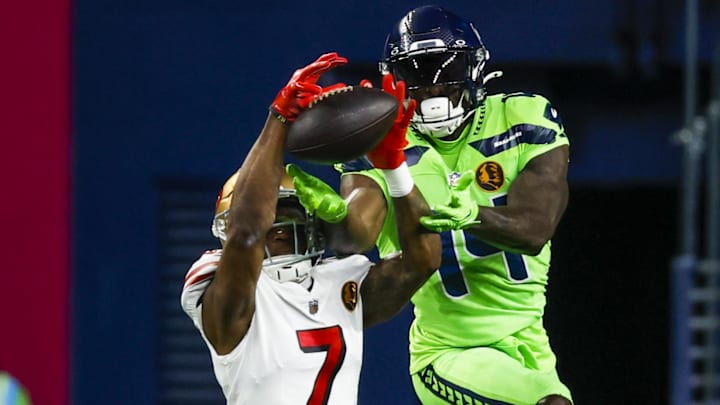 Nov 23, 2023; Seattle, Washington, USA; San Francisco 49ers cornerback Charvarius Ward (7) breaks up a pass intended for Seattle Seahawks wide receiver DK Metcalf (14) during the first quarter at Lumen Field. Mandatory Credit: Joe Nicholson-Imagn Images