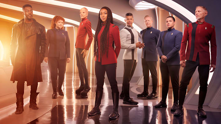 L-R David Ajala as Book, Mary Wiseman as Tilly, Doug Jones as Saru, Sonequa Martin-Green as Burnham, Wilson Cruz as Culber, Blu Del Barrio as Adira and Callum Keith Rennie as Raynor in season 5 of the Paramount+ original series STAR TREK: DISCOVERY. Photo Credit: James Dimmock/Paramount+