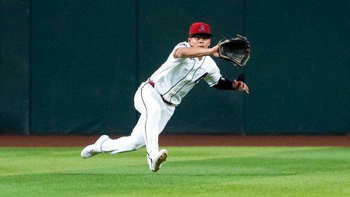 Jun 1, 2026; Phoenix, Arizona, USA; Arizona Diamondbacks outfielder Jorge Barrosa makes a diving catch in the fifth inning against the Los Angeles Dodgers at Chase Field. Mandatory Credit: Mark J. Rebilas-Imagn Images