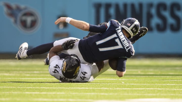 Jan 7, 2024; Nashville, Tennessee, USA;  Jacksonville Jaguars linebacker Travon Walker (44) sacks Tennessee Titans quarterback Ryan Tannehill (17) during the first half at Nissan Stadium. Mandatory Credit: Steve Roberts-USA TODAY Sports