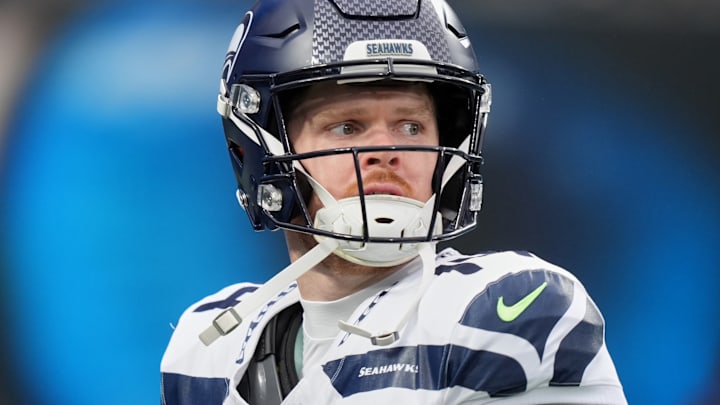 Dec 28, 2025; Charlotte, North Carolina, USA; Seattle Seahawks quarterback Sam Darnold (14) looks on before the game against the Carolina Panthers at Bank of America Stadium.