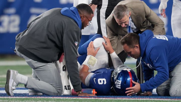 Oct 9, 2025; East Rutherford, New Jersey, USA; Trainers check on New York Giants quarterback Jaxson Dart (6) after an injury against the Philadelphia Eagles during the third quarter of the game at MetLife Stadium.  