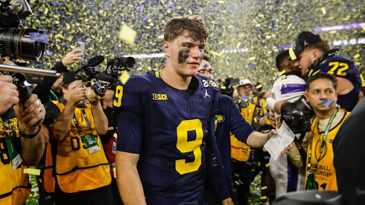 Michigan quarterback J.J. McCarthy celebrates after the 34-13 win over Washington to win the national title Michigan quarterback J.J. McCarthy celebrates after the 34-13 win over Washington to win the national title