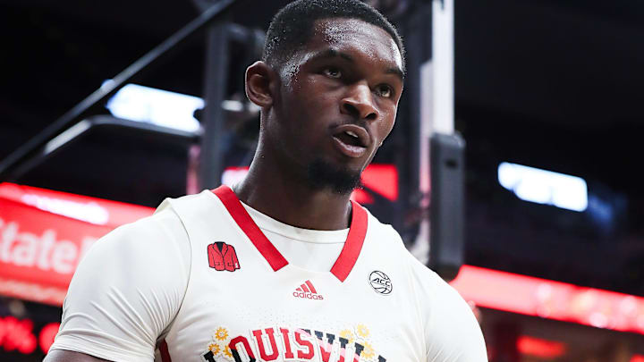 U of L's Brandon Huntley-Hatfield (5) reacts after hitting a shot while being fouled against Notre Dame.