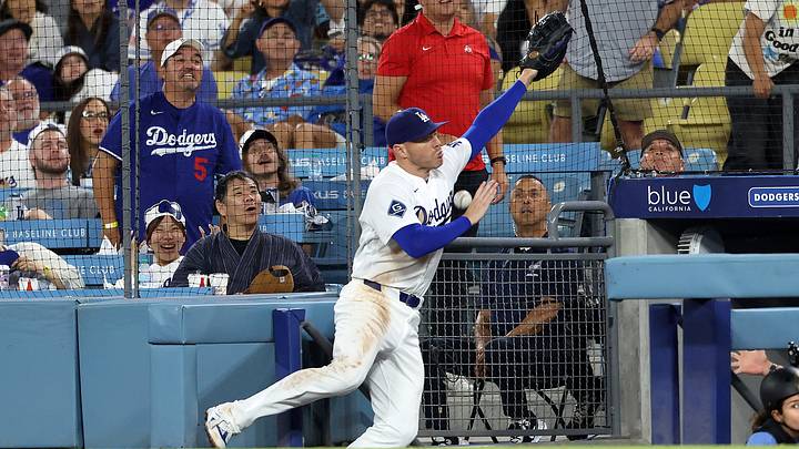 Aug 12, 2026; Los Angeles, California, USA;  Los Angeles Dodgers first baseman Freddie Freeman (5) falls into the dugout while chasing a foul ball during the eighth inning against the Kansas City Royals at Dodger Stadium. Mandatory Credit: Kiyoshi Mio-Imagn Images