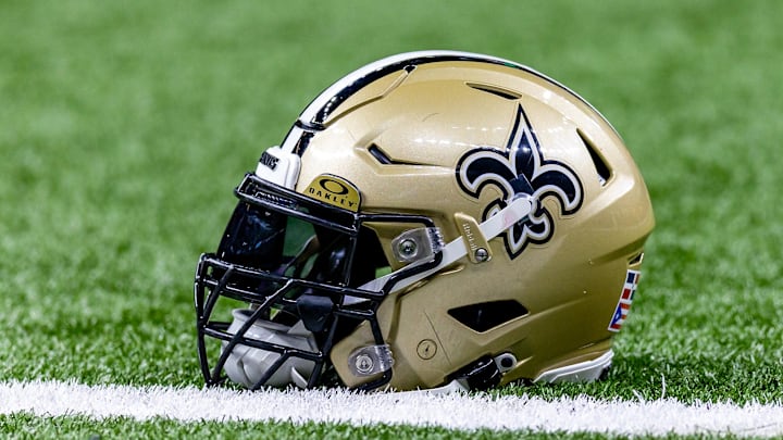 Jan 7, 2024; New Orleans, Louisiana, USA; Detailed view of the New Orleans Saints helmet during warmups against the Atlanta Falcons at Caesars Superdome. Mandatory Credit: Stephen Lew-Imagn Images