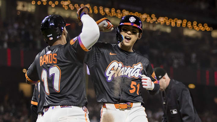 May 13, 2025; San Francisco, California, USA; San Francisco Giants center fielder Jung Hoo Lee (51) is congratulated by left fielder Heliot Ramos (17) after he hit a three-run home run against the Arizona Diamondbacks during the eighth inning at Oracle Park.