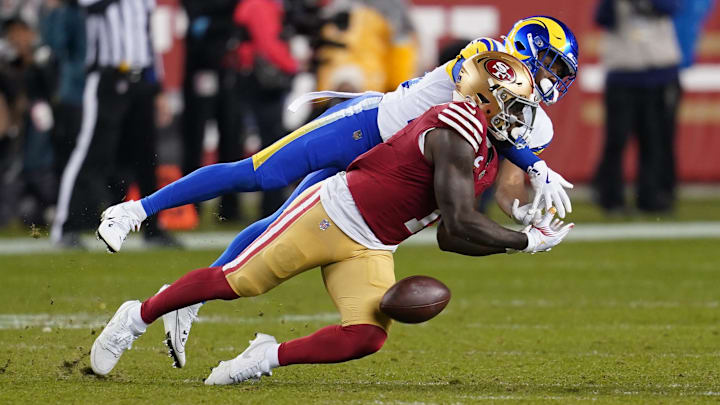 Dec 12, 2024; Santa Clara, California, USA; Los Angeles Rams safety Kamren Kinchens (26) breaks up a pass intended for San Francisco 49ers wide receiver Deebo Samuel Sr. (1) in the fourth quarter at Levi's Stadium. Mandatory Credit: Cary Edmondson-Imagn Images