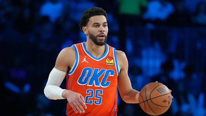 Dec 13, 2025; Las Vegas, Nevada, USA; Oklahoma City Thunder guard Ajay Mitchell (25) brings the ball up court against the San Antonio Spurs during the second quarter at T-Mobile Arena. Mandatory Credit: Kirby Lee-Imagn Images Dec 13, 2025; Las Vegas, Nevada, USA; Oklahoma City Thunder guard Ajay Mitchell (25) brings the ball up court against the San Antonio Spurs during the second quarter at T-Mobile Arena. Mandatory Credit: Kirby Lee-Imagn Images