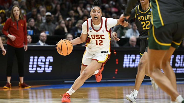 USC Trojans guard JuJu Watkins (12) drives to the basket during the second half against Baylor Lady Bears guard Bella Fontleroy (22) in the semifinals of the Portland Regional of the 2024 NCAA Tournament at the Moda Center.