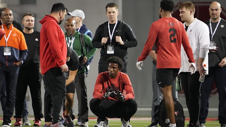 Mar 23, 2022; Columbus, Ohio, USA; Ohio State Buckeyes wide receiver Garrett Wilson talks to head coach Ryan Day and receiver Chris Olave during the football pro day at the Woody Hayes Athletic Center in Columbus, Ohio. Mandatory Credit: Adam Cairns-Imagn Images