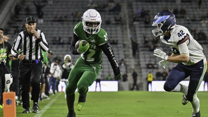 CJ Williams attempts to run past a Granite Hills defender in last season's San Diego Section Open Division championship game | Photo: Justin Fine CJ Williams attempts to run past a Granite Hills defender in last season's San Diego Section Open Division championship game | Photo: Justin Fine