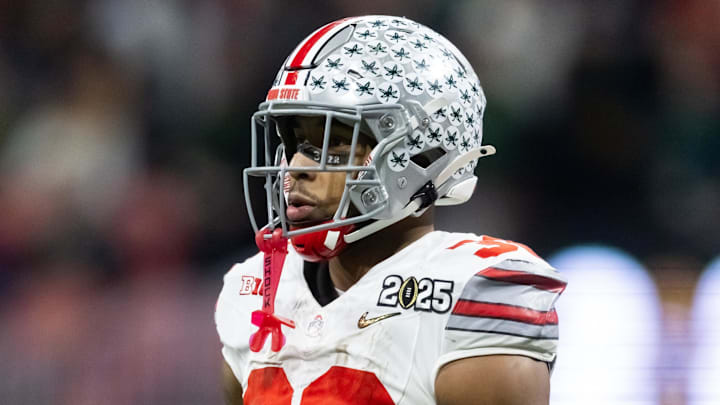 Jan 20, 2025; Atlanta, GA, USA; Ohio State Buckeyes running back TreVeyon Henderson (32) against the Notre Dame Fighting Irish during the CFP National Championship college football game at Mercedes-Benz Stadium.  