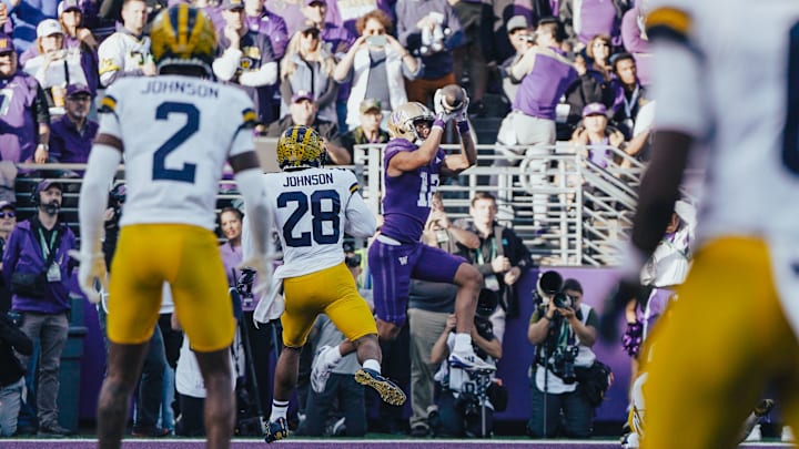 Denzel Boston catches his 8th touchdown pass against Michigan. 
