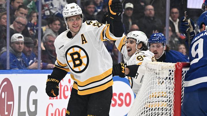 Nov 8, 2025; Toronto, Ontario, CAN;  Boston Bruins forward David Pastrnak (88) celebrates with forward Marat Khusnutdinov (92)after scoring a goal against the Toronto Maple Leafs in the second period at Scotiabank Arena. Mandatory Credit: Dan Hamilton-Imagn Images