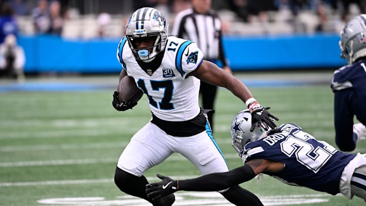 Dec 15, 2024; Charlotte, North Carolina, USA; Carolina Panthers wide receiver Xavier Legette (17) with the ball as Dallas Cowboys cornerback Amani Oruwariye (27) defefends in the first quarter at Bank of America Stadium.