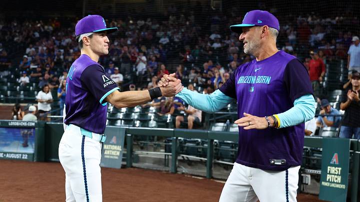 Aug 7, 2026; Phoenix, Arizona, USA; Arizona Diamondbacks outfielder Corbin Carroll (left) with manager Torey Lovullo as he is honored for becoming the all time franchise leader for triples prior to the game against the Los Angeles Dodgers at Chase Field. Mandatory Credit: Mark J. Rebilas-Imagn Images Aug 7, 2026; Phoenix, Arizona, USA; Arizona Diamondbacks outfielder Corbin Carroll (left) with manager Torey Lovullo as he is honored for becoming the all time franchise leader for triples prior to the game against the Los Angeles Dodgers at Chase Field. Mandatory Credit: Mark J. Rebilas-Imagn Images