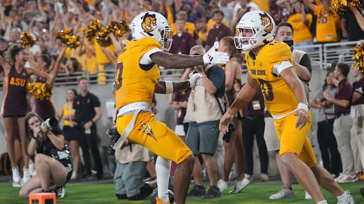 Arizona State quarterback Sam Leavitt (10) celebrates his touchdown run with teammate Jordyn Tyson (0) Jordyn Tyson against the Mississippi State Bulldogs at Mountain America Stadium in Tempe on Sept. 7, 2024.
