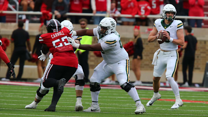 Oct 19, 2024; Lubbock, Texas, USA;  Baylor Bears offensive lineman Omar Aigbedion (68) blocks Texas Tech Red Raiders defensive tackle De’Braylon Carroll (52) in the second half at Jones AT&T Stadium and Cody Campbell Field. Mandatory Credit: Michael C. Johnson-Imagn Images