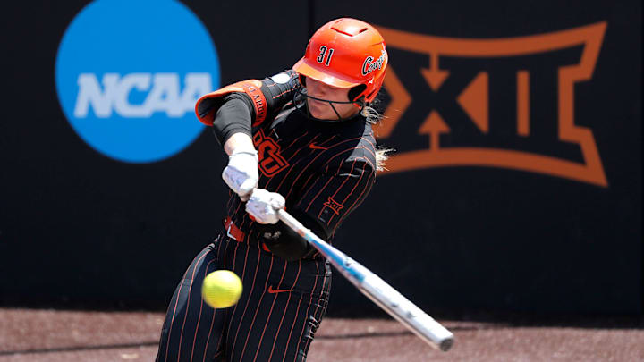 Oklahoma State's Lexi McDonald (31) hits a home run in the second inning of a softball game between the Oklahoma State Cowgirls and Michigan in the finals of the Stillwater Regional of the NCAA Tournament, Sunday, May 19, 2024. Oklahoma State won 4-1.