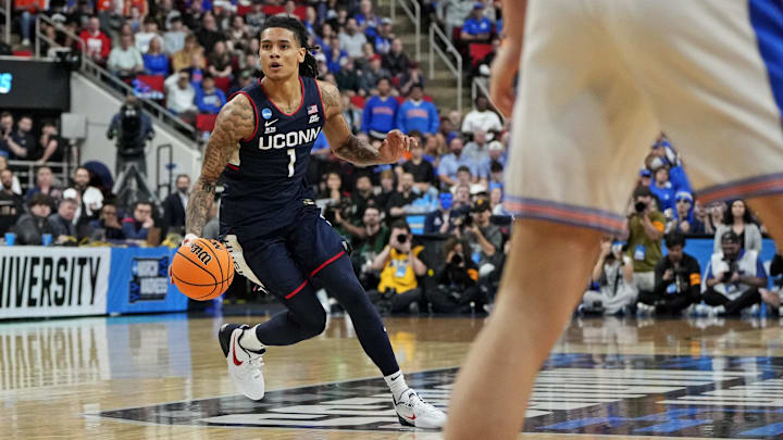 Mar 23, 2025; Raleigh, NC, USA; Connecticut Huskies guard Solo Ball (1) drives to the basket during the first half against the Florida Gators in the second round of the NCAA Tournament at Lenovo Center. Mandatory Credit: Bob Donnan-Imagn Images Mar 23, 2025; Raleigh, NC, USA; Connecticut Huskies guard Solo Ball (1) drives to the basket during the first half against the Florida Gators in the second round of the NCAA Tournament at Lenovo Center. Mandatory Credit: Bob Donnan-Imagn Images