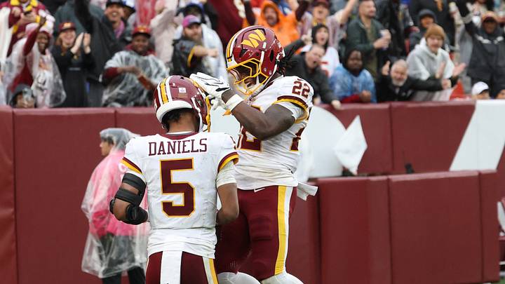 Oct 11, 2026; Landover, Maryland, USA; Washington Commanders quarterback Jayden Daniels (5) celebrates a 22 yard touchdown with running back Jacory Croskey-Merritt (22) during the third quarter against the New York Giants at Northwest Stadium. Mandatory Credit: Geoff Burke-Imagn Images Oct 11, 2026; Landover, Maryland, USA; Washington Commanders quarterback Jayden Daniels (5) celebrates a 22 yard touchdown with running back Jacory Croskey-Merritt (22) during the third quarter against the New York Giants at Northwest Stadium. Mandatory Credit: Geoff Burke-Imagn Images