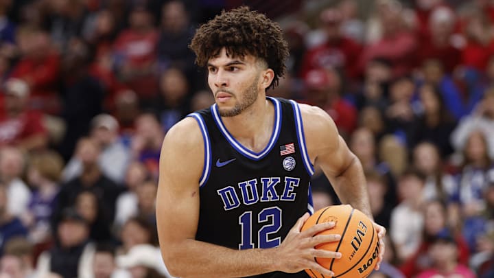Nov 27, 2025; Chicago, Illinois, USA; Duke Blue Devils forward Cameron Boozer (12) looks to pass the ball against Arkansas Razorbacks during the second half at United Center. Mandatory Credit: Kamil Krzaczynski-Imagn Images Nov 27, 2025; Chicago, Illinois, USA; Duke Blue Devils forward Cameron Boozer (12) looks to pass the ball against Arkansas Razorbacks during the second half at United Center. Mandatory Credit: Kamil Krzaczynski-Imagn Images