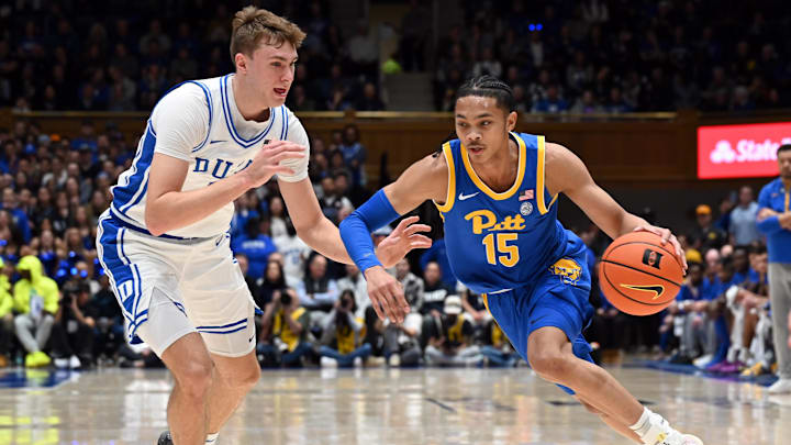 Jan 7, 2025; Durham, North Carolina, USA; Pittsburgh Panthers guard Jaland Lowe (15) drives to the basket as Duke Blue Devils forward Cooper Flagg (2) defends during the first half at Cameron Indoor Stadium. Mandatory Credit: Rob Kinnan-Imagn Images