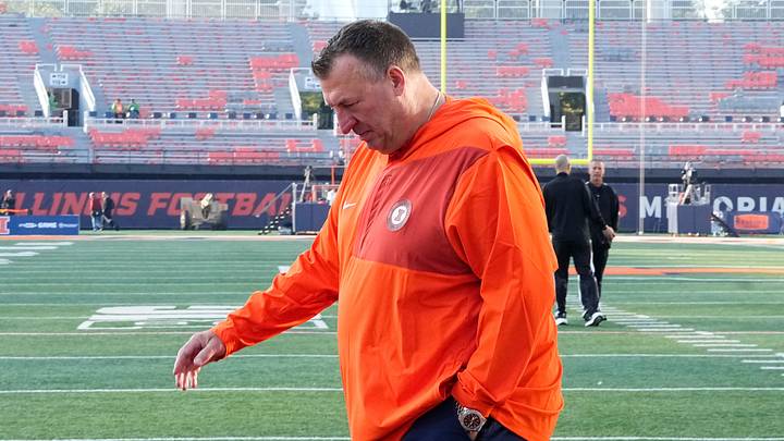 Illinois Fighting Illini head coach Bret Bielema walks across the field as the team arrives prior to the NCAA football game against the Ohio State Buckeyes at Gies Memorial Stadium in Champaign on Oct. 11, 2025. Illinois Fighting Illini head coach Bret Bielema walks across the field as the team arrives prior to the NCAA football game against the Ohio State Buckeyes at Gies Memorial Stadium in Champaign on Oct. 11, 2025.