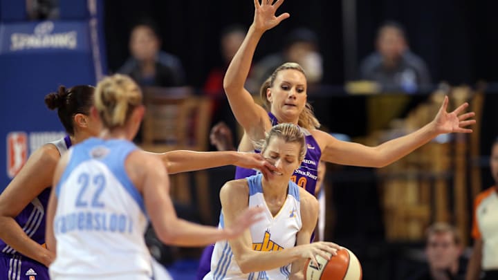 Sep 12, 2014; Chicago, IL, USA; Chicago Sky guard Allie Quigley (14) is hit in the face by Phoenix Mercury guard Diana Taurasi (left) while defended by forward Penny Taylor (rear) during the first quarter in game three of the 2014 WNBA Finals at UIC Pavilion. Mandatory Credit: Jerry Lai-Imagn Images Sep 12, 2014; Chicago, IL, USA; Chicago Sky guard Allie Quigley (14) is hit in the face by Phoenix Mercury guard Diana Taurasi (left) while defended by forward Penny Taylor (rear) during the first quarter in game three of the 2014 WNBA Finals at UIC Pavilion. Mandatory Credit: Jerry Lai-Imagn Images